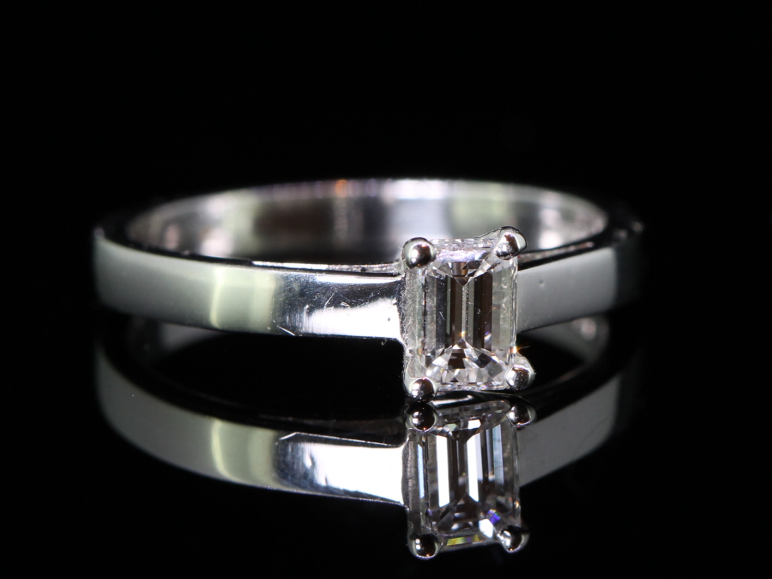 Breathtaking Emerald Cut Diamond Solitaire Platinum Ring