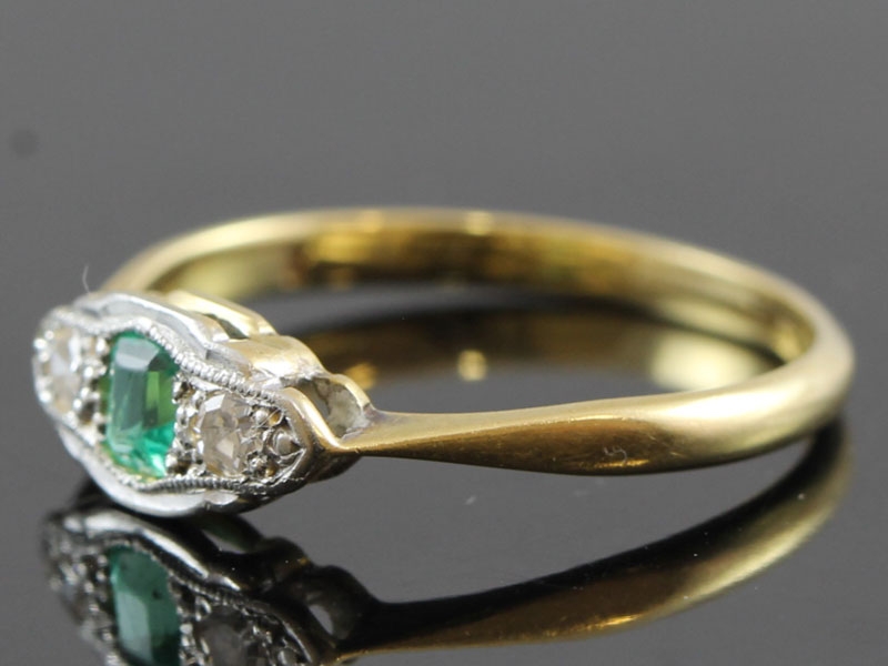 STYLISH EMERALD AND DIAMOND PLATINUM AND 18 CARAT GOLD RING 