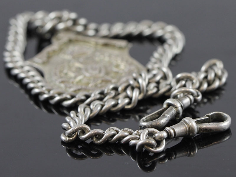 ANTIQUE SILVER ALBERT CHAIN AND MEDAL FOB