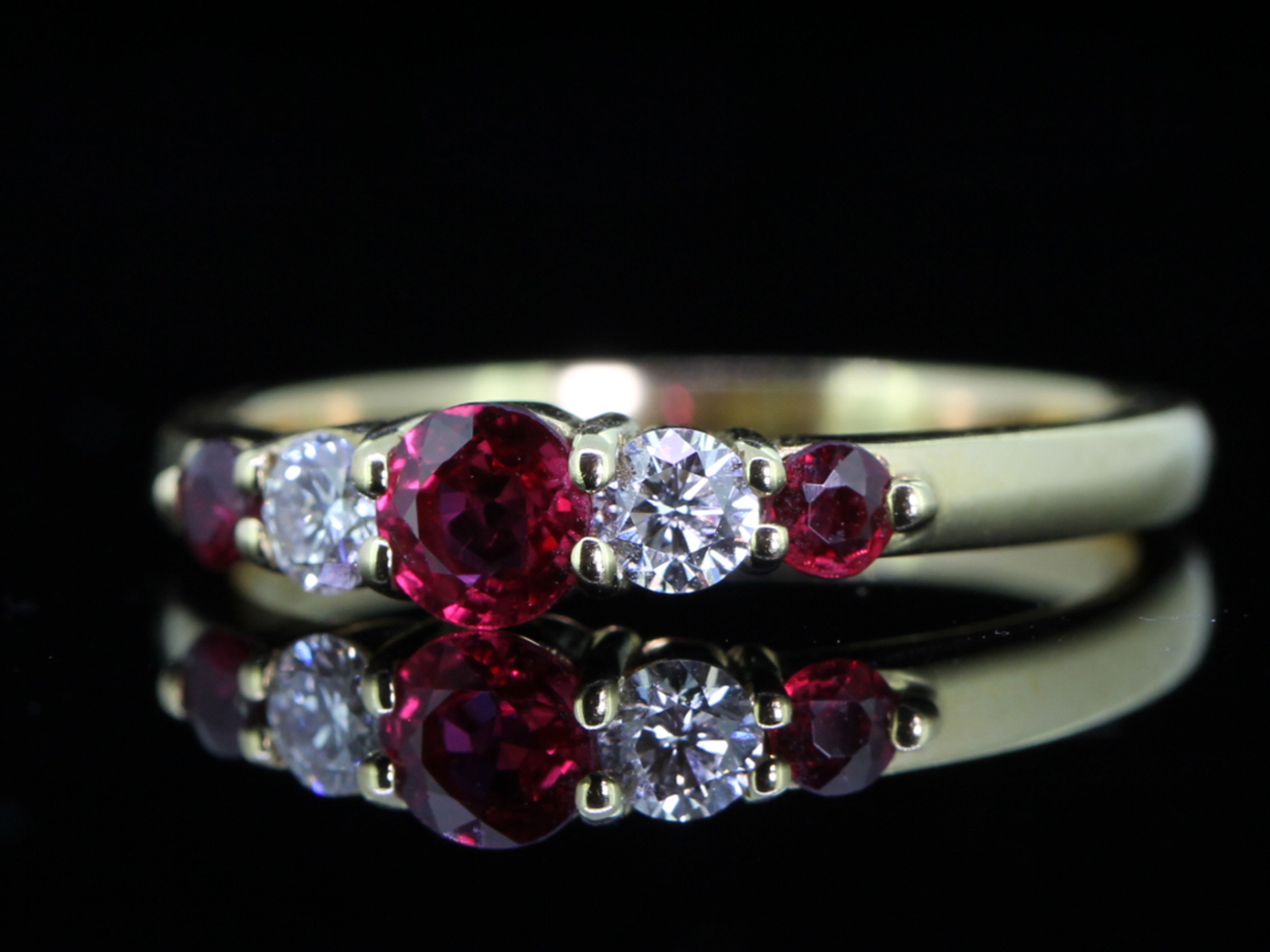RADIANT NATURAL RUBY AND DIAMOND 18 CARAT GOLD FIVE STONE RING