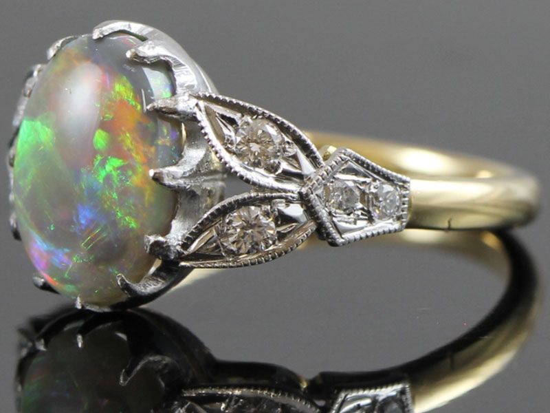 WONDERFUL OPAL AND DIAMOND 18 CARAT GOLD RING