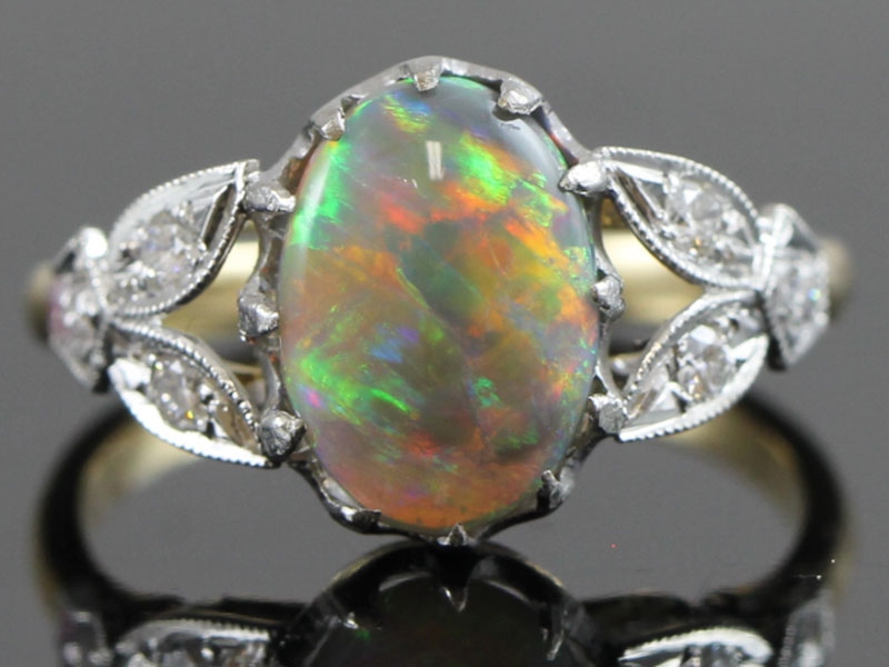 WONDERFUL OPAL AND DIAMOND 18 CARAT GOLD RING