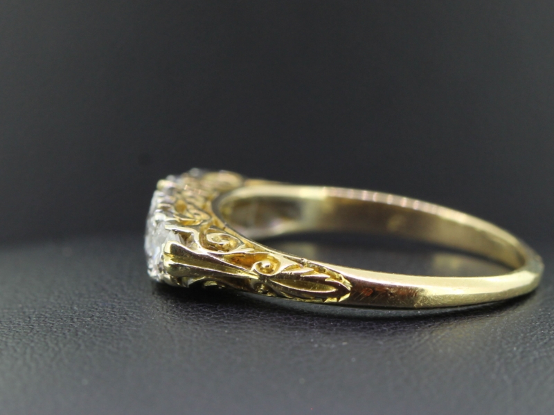 PRETTY EDWARDIAN FIVE STONE DIAMOND 18 CARAT GOLD RING