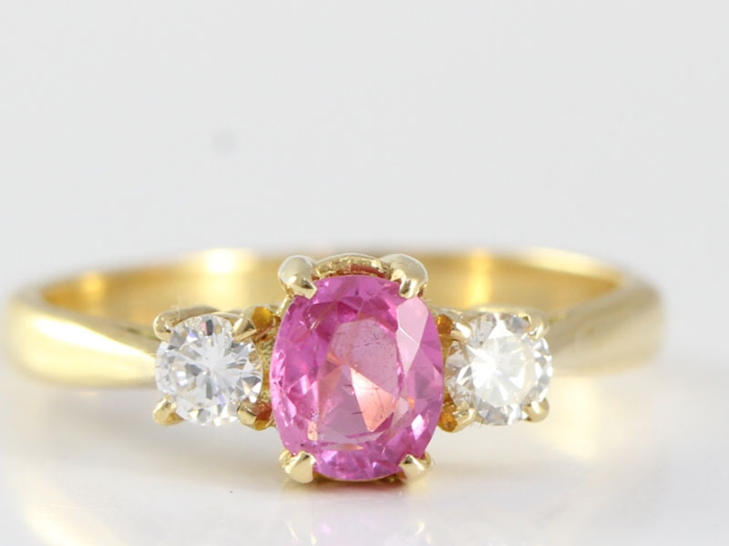 ENCHANTING PINK SAPPHIRE AND DIAMOND 18 CARAT GOLD TRILOGY RING