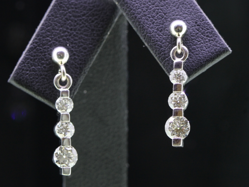 ELEGANT THREE DIAMOND DROP 18 CARAT GOLD EARRINGS