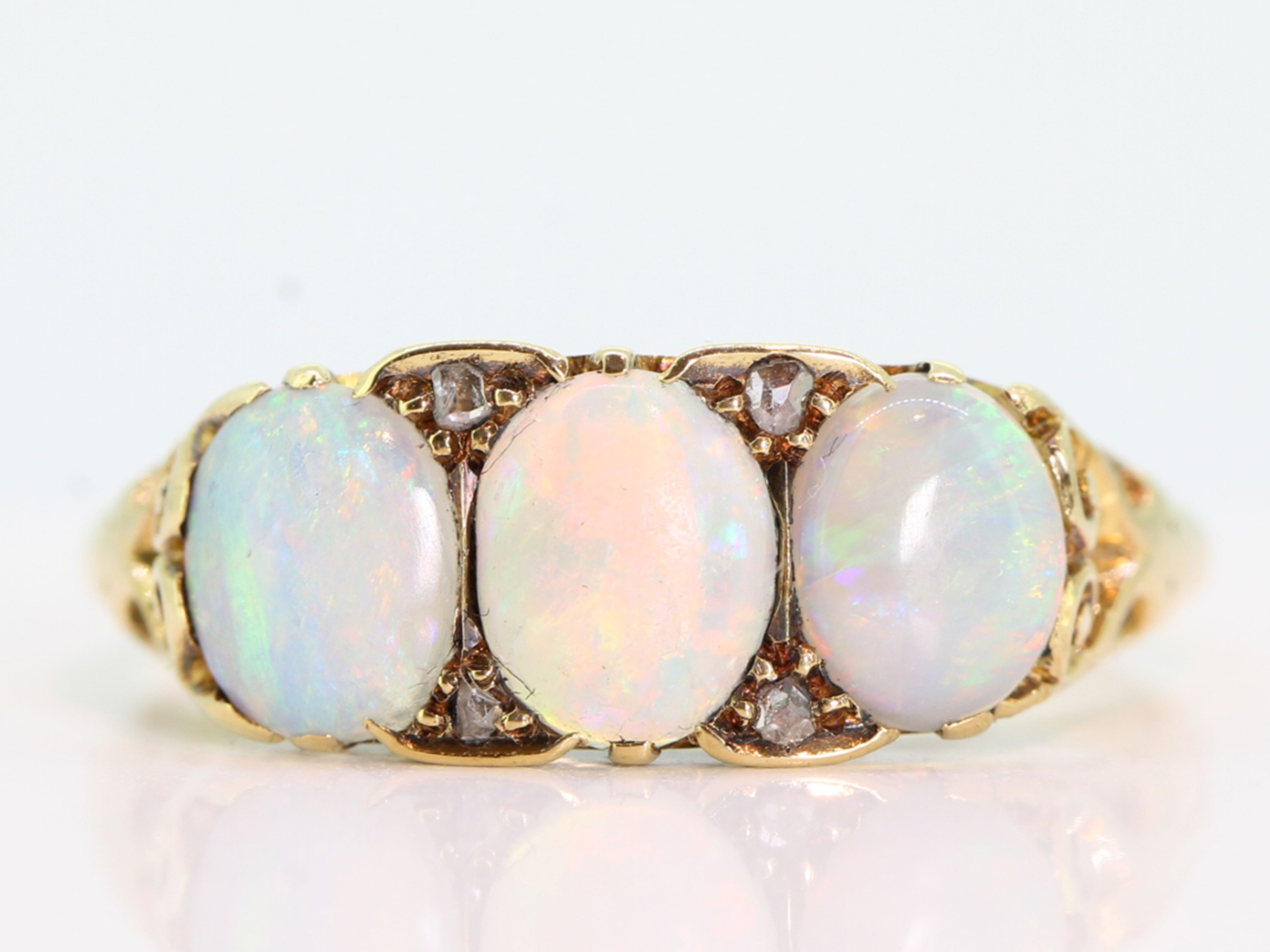 COLOURFUL THREE STONE OPAL AND DIAMOND 18 CARAT GOLD RING