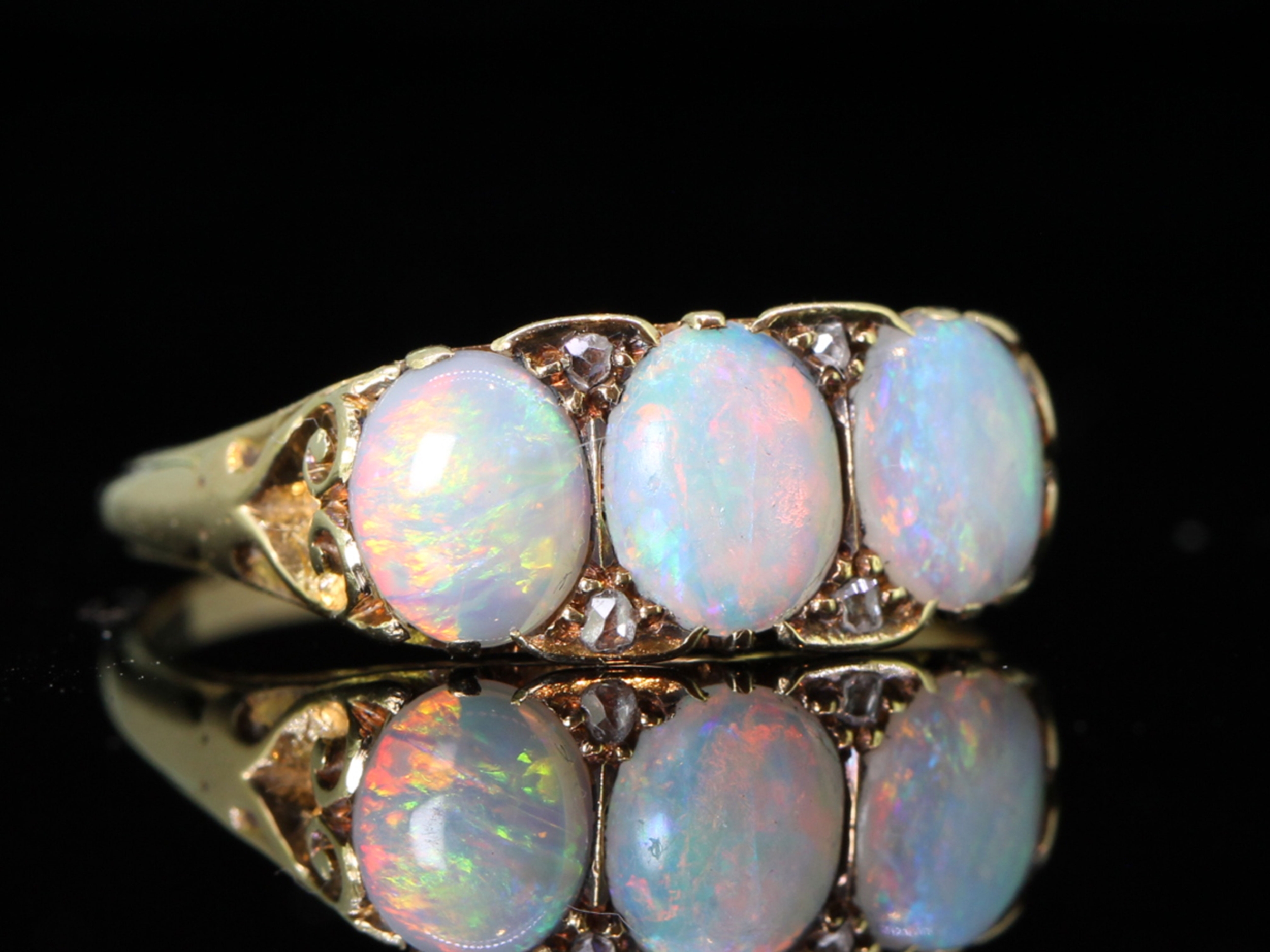 COLOURFUL THREE STONE OPAL AND DIAMOND 18 CARAT GOLD RING