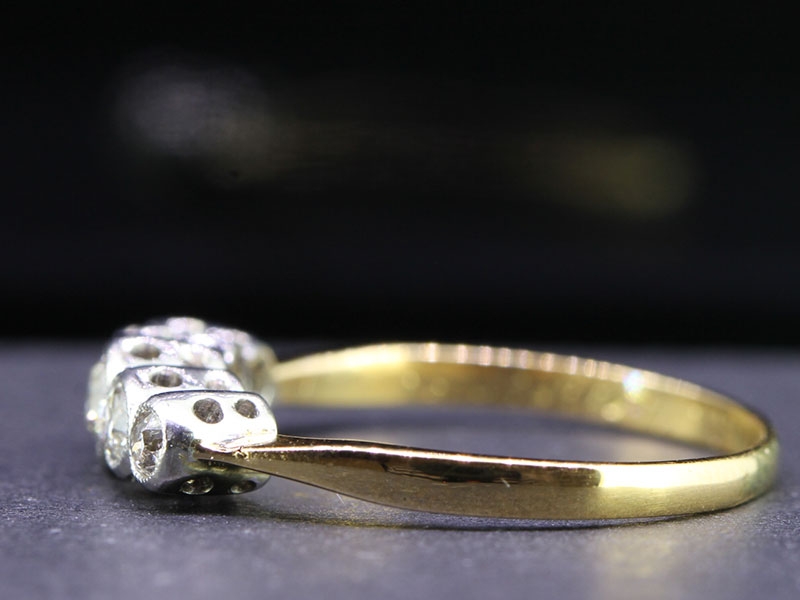 CHARMING FIVE STONE 18 CARAT GOLD AND PLATINUM RING