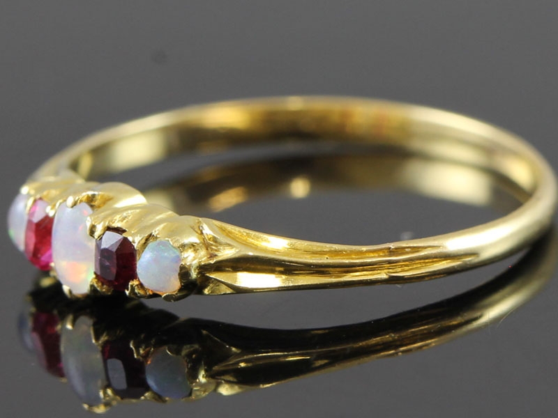 PRETTY RUBY AND OPAL EDWARDIAN 18 CARAT GOLD RING