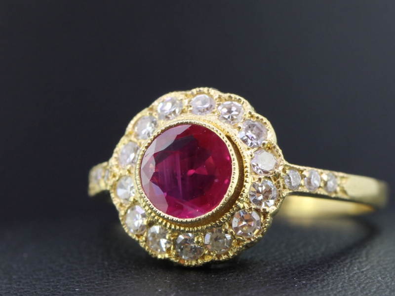 LUXURIOUS RUBY AND DIAMOND 18 CARAT GOLD HALO RING