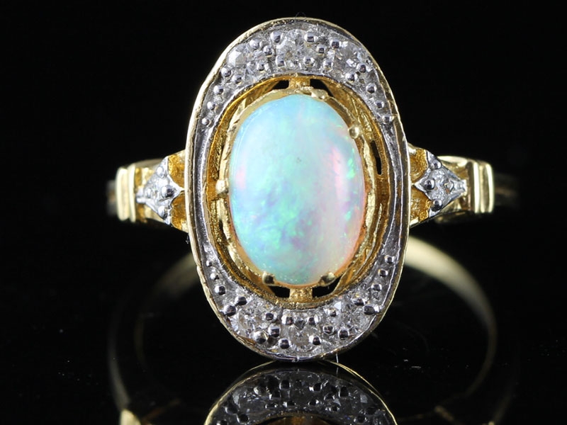 ENCHANTING OPAL AND DIAMOND 18 CARAT GOLD RING