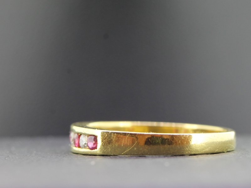 LOVELY RUBY AND DIAMOND HALF ETERNITY 18 CARAT GOLD RING