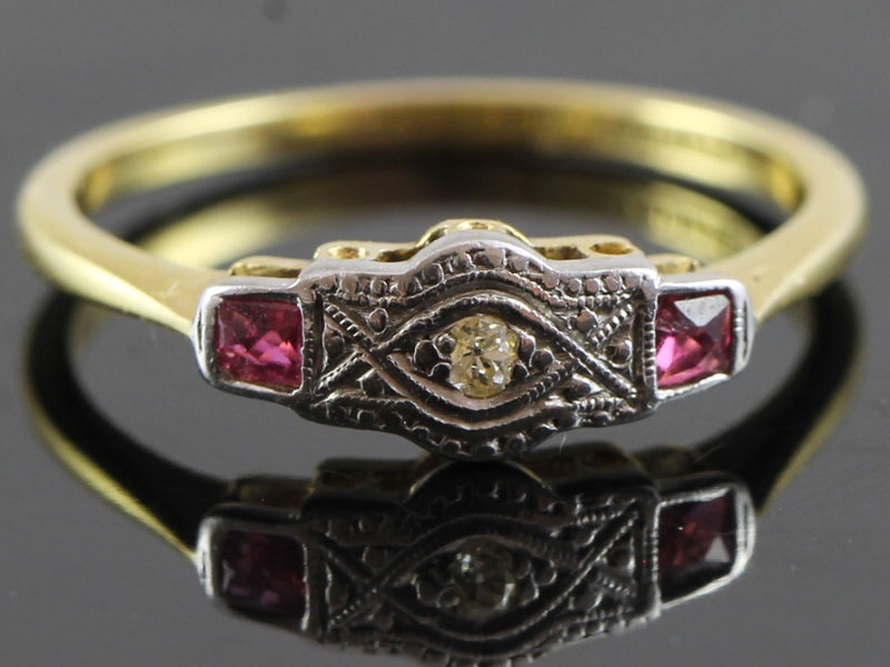 EXQUISITE RUBY AND DIAMOND PLATINUM AND 18 CARAT GOLD RING