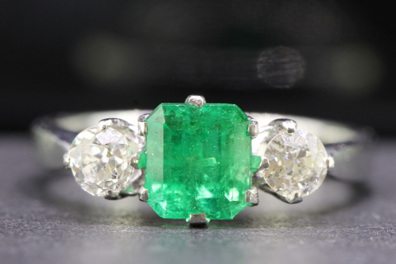 MESMERISING EDWARDIAN EMERALD AND DIAMOND TRILOGY PLATINUM AND 18 CARAT GOLD RING