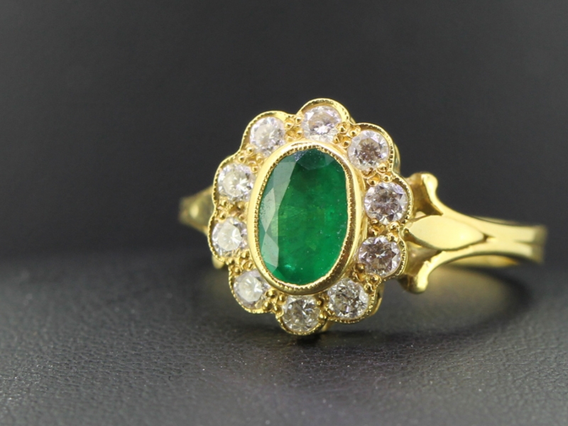 TANTALISING COLUMBIAN EMERALD AND DIAMOND 18 CARAT GOLD HALO CLUSTER