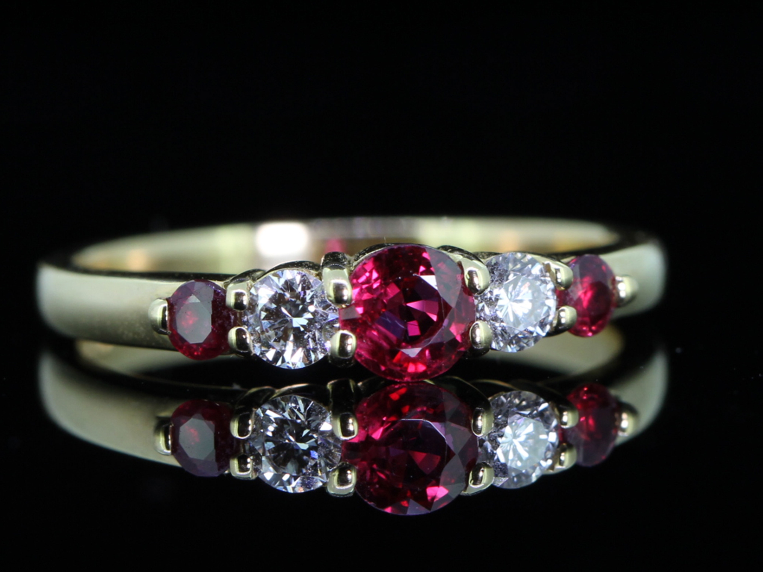 RADIANT NATURAL RUBY AND DIAMOND 18 CARAT GOLD FIVE STONE RING