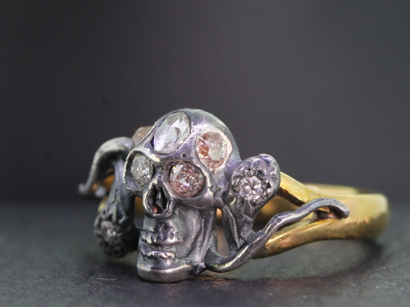MAGNIFICENT 22 CARAT GOLD SILVER SET DIAMOND SKULL AND SERPENT RING