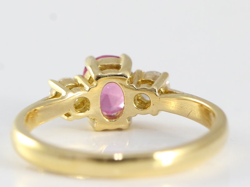 ENCHANTING PINK SAPPHIRE AND DIAMOND 18 CARAT GOLD TRILOGY RING