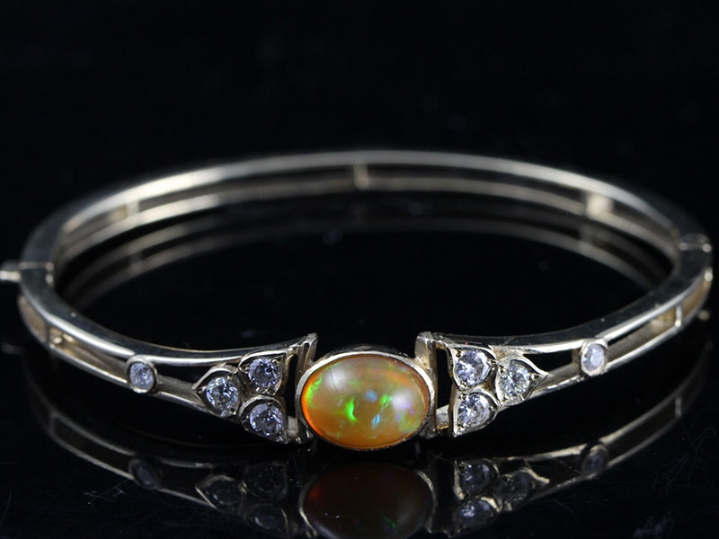 EXCEPTIONAL OPAL AND DIAMOND 9 CARAT GOLD BANGLE