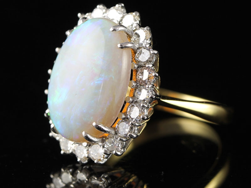 MAGNIFICENT 6 CARAT OPAL AND DIAMOND CLUSTER 18 CARAT GOLD RING