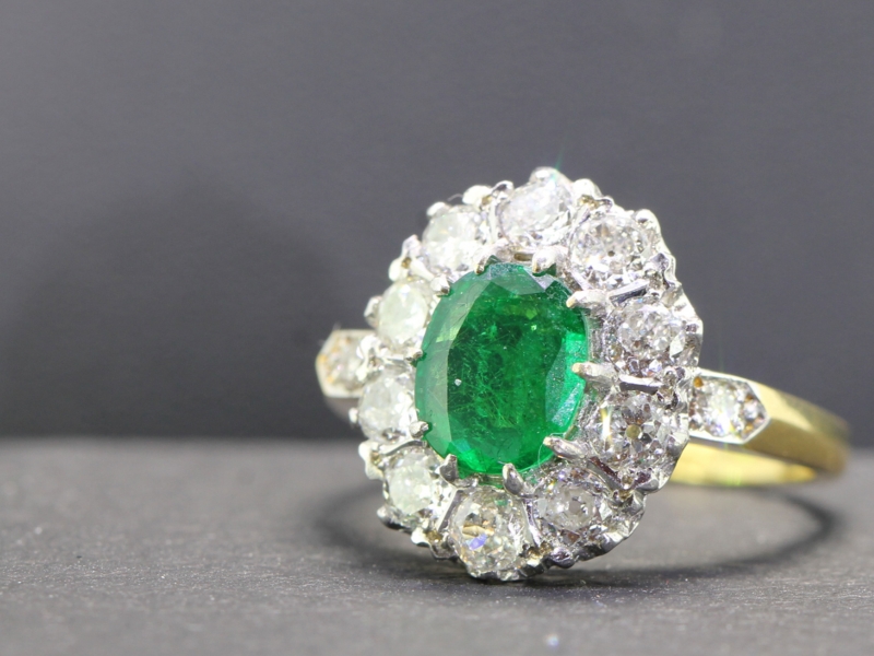 SOPHISTICATED EMERALD AND DIAMOND 18 CARAT GOLD CLUSTER RING
