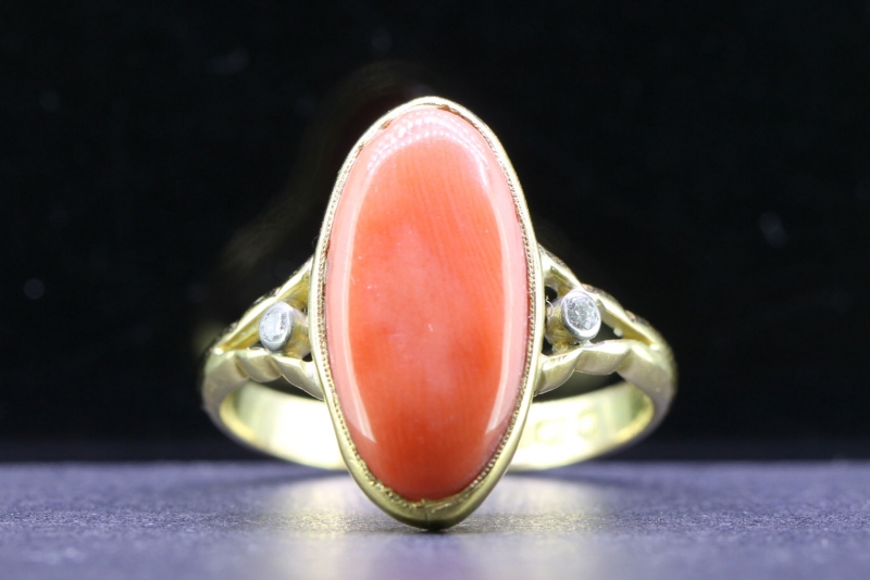 STRIKING OVAL NATURAL CORAL AND DIAMOND 18 CARAT GOLD RING