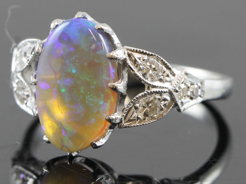 STUNNING BLACK OPAL AND DIAMOND 18 CARAT GOLD RING