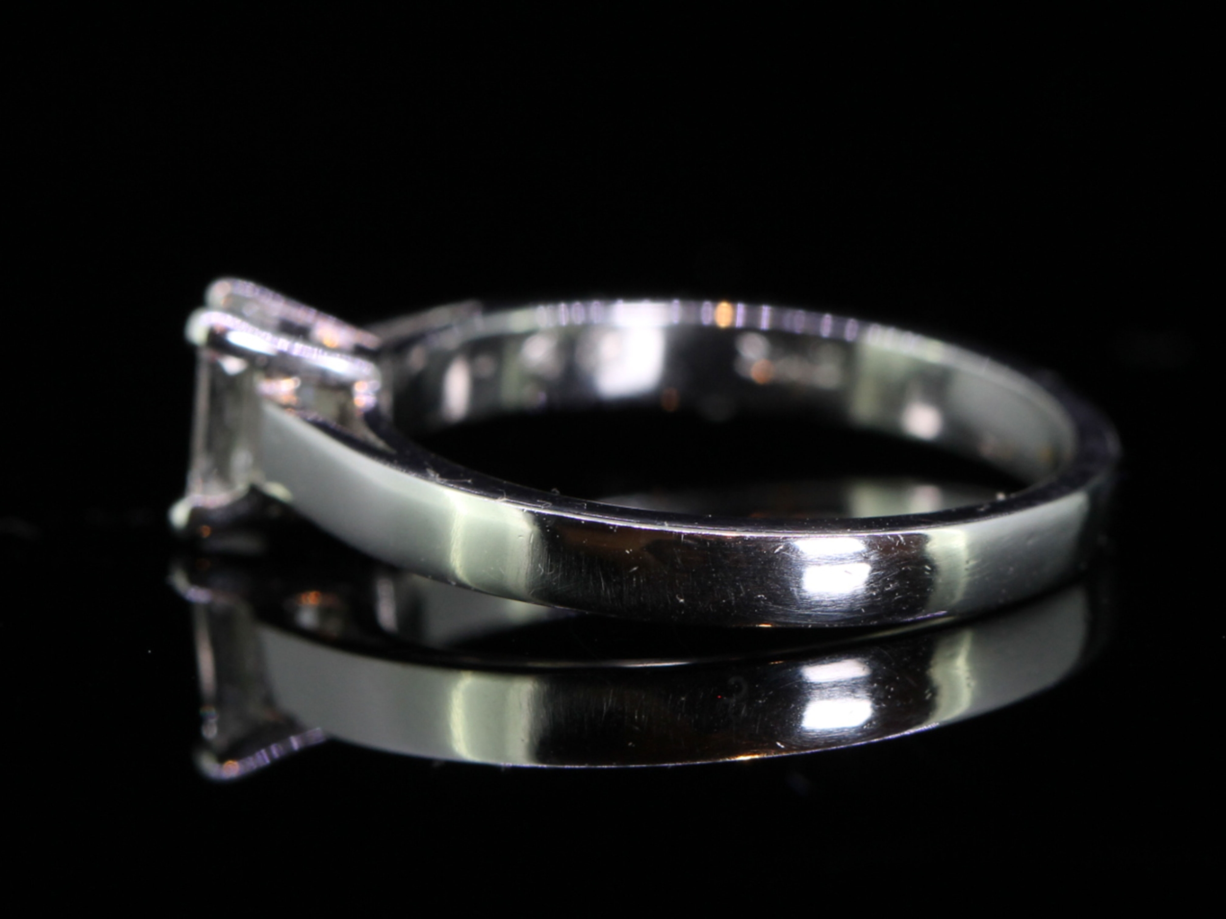 Breathtaking Emerald Cut Diamond Solitaire Platinum Ring