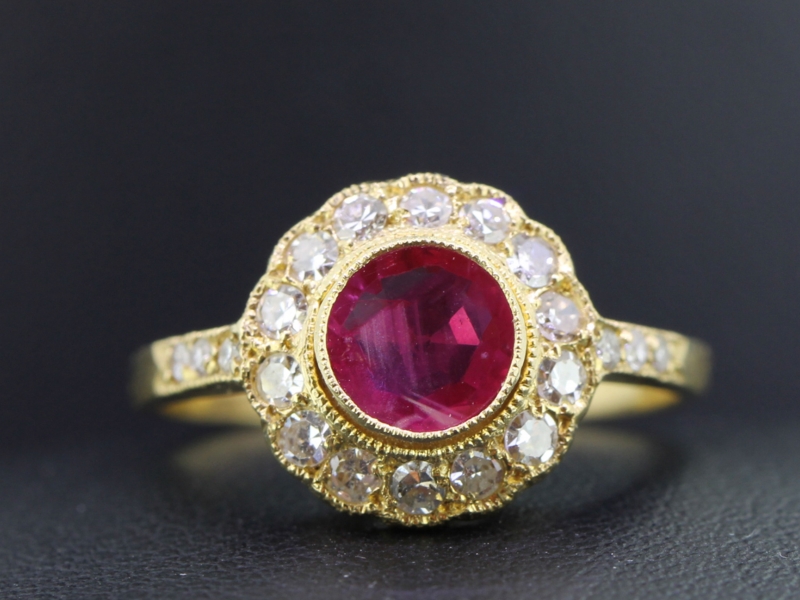 LUXURIOUS RUBY AND DIAMOND 18 CARAT GOLD HALO RING