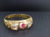 PRETTY RUBY AND DIAMOND 18 CARAT GOLD BAND