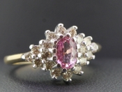 STUNNING OVAL PINK SAPPHIRE AND DIAMOND 9 CARAT GOLD CLUSTER RING