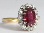  A DAZZLING RUBY AND DIAMOND 18 CARAT GOLD CLUSTER RING