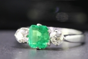 MESMERISING EDWARDIAN EMERALD AND DIAMOND TRILOGY PLATINUM AND 18 CARAT GOLD RING