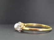 PRETTY PEARL AND DIAMOND TRILOGY 18 CARAT GOLD RING