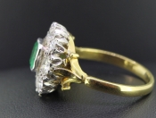 STUNNING COLOMBIAN EMERALD AND DIAMOND 18 CARAT GOLD CLUSTER RING