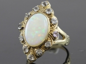 STYLISH REVIVAL INSPIRED TURN OF THE CENTURY 9 CARAT OPAL AND BLUE ZIRCON RING