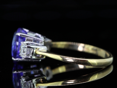 Stunning 3 Carat Tanzanite and Diamond  8 Carat  Gold Trilogy Ring