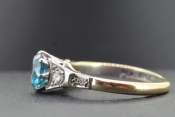 STUNNING BLUE ZIRCON AND DIAMOND 18 CARAT GOLD RING