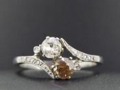  ELEGANT TWO STONE DIAMOND PLATINUM RING ON A TWIST