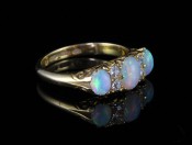 A STUNNING GENUINE EDWARDIAN AUSTRALIAN OPAL AND DIAMOND 15CT RING