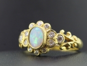 ALLURING OPAL AND DIAMOND 18 CARAT GOLD RING