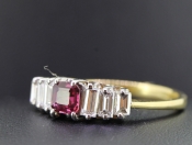 STUNNING SEVEN STONE RUBY AND DIAMOND 18 CARAT GOLD RING