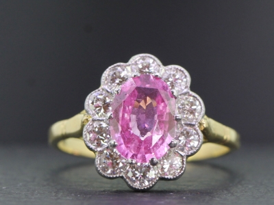 STUNNING PINK SAPPHIRE AND DIAMOND 18 CARAT GOLD AND PLATINUM CLUSTER RING