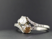  ELEGANT TWO STONE DIAMOND PLATINUM RING ON A TWIST