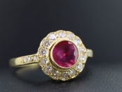 LUXURIOUS RUBY AND DIAMOND 18 CARAT GOLD HALO RING