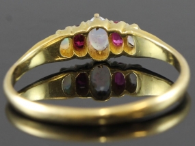 PRETTY RUBY AND OPAL EDWARDIAN 18 CARAT GOLD RING