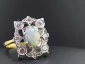 STUNNING OPAL AND DIAMOND 18 CARAT GOLD RING