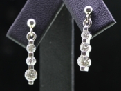 ELEGANT THREE DIAMOND DROP 18 CARAT GOLD EARRINGS