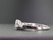 GORGEOUS DIAMOND SOLITAIRE WITH DIAMOND BAGUETTE SHOULDERS CRAFTED IN PLATINUM