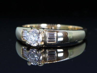 Diamond Solitaire with Baguette Diamond Shoulders 18ct Gold Ring
